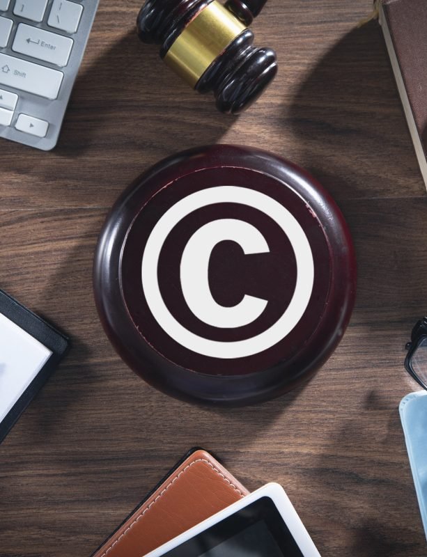 Judge gavel with a business objects. Copyright. Intellectual Property